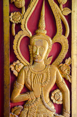 fairy statue on door of church