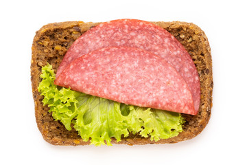 Sandwich with salami sausage on white background.
