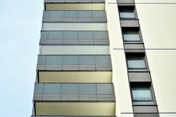Multistory new modern apartment building. Stylish living block of flats.