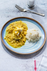 Haddock in creamed coconut and corn curry with rice