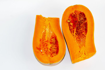 pumpkin fresh two halves on white background top view