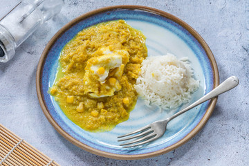 Haddock in creamed coconut and corn curry with rice