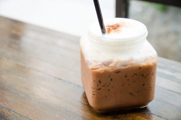 thai tea in bottle on wooden table