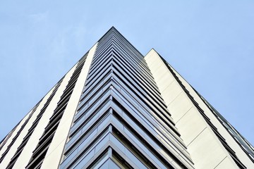 Multistory new modern apartment building. Stylish living block of flats.