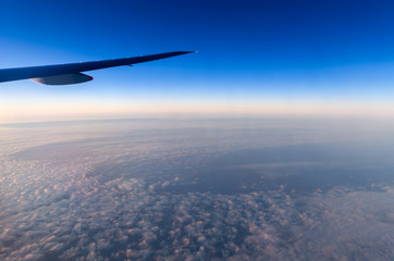 Fototapeta na wymiar Beautiful sky in evening from window airplane