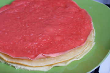 Cooking the pie with mascarpone cream. Ready cake pies lying on a plate.