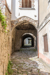 Fototapeta na wymiar Ancient Street and Archway in Southern Italy
