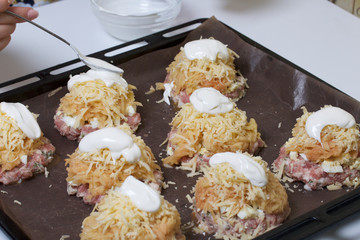 Minced meat steaks with potatoes, eggs and cheese. Cooking steps and ingredients.