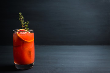 Bloody oranges beverage with thyme. Selective focus. Shallow depth of field.