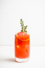 Bloody oranges beverage with thyme. Selective focus. Shallow depth of field.