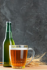 Single beer glass close up on dark stone background