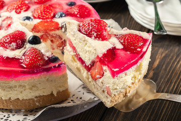 Cheesecake with strawberries, blueberry and jelly