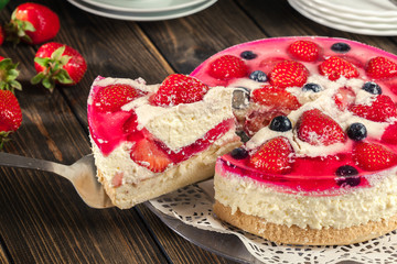 Cheesecake with strawberries, blueberry and jelly
