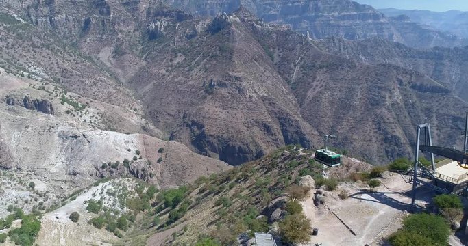 Aerial shot of a cable car arriving to the station in the Urique Canyon in Divisadero, Copper Canyon Region, Chihuahua