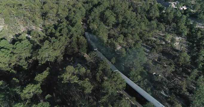 Aerial shot of the Chepe train passing though a forest, Divisadero, Copper Canyon Region, Chihuahua