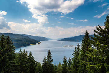 Fototapeta na wymiar Beautiful scenery with big blue lake, forest , mountans and blue sky