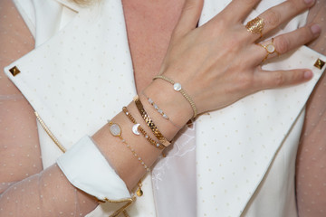 Close up Detail of many several bracelet on a Female Hand Model - obrazy, fototapety, plakaty