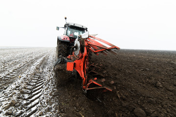 Tractor plowing a field