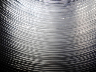 Many optical fiber cables hanging, forming an arc shape. This cables allow internet to work,...