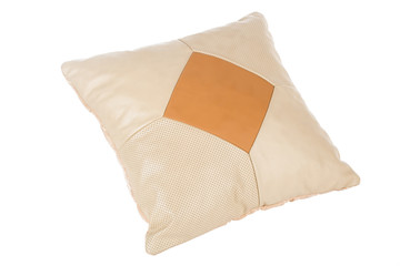 White-beige small handmade pillow with white stitching from genuine leather on a white isolated background, side view.