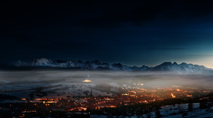 beautiful view of Zakopane and the Polish Tatra Mountains at night - obrazy, fototapety, plakaty