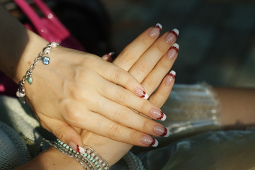 Fototapeta premium Manicure, French white with red sequins