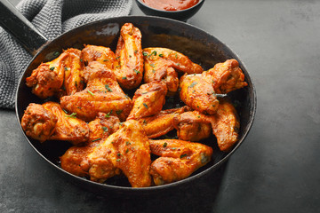 Chicken wings grilled in sauce on pan