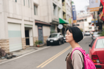 walking Asian traveling woman