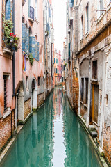 Fototapeta na wymiar Beatiful and empty canal in Venice, Italy