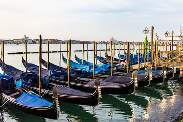Empty gondolas floating on a lagoon of Venice, Italy