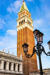 Fototapeta na wymiar Historic bell tower in San Marco square in Venice, Italy