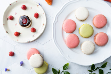 Macaron or French macaroon cookies dessert. Set on cafe table.