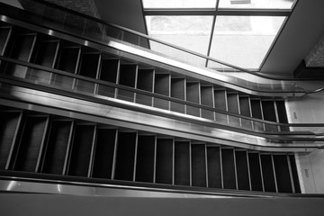 black and white escalator with light and shadow