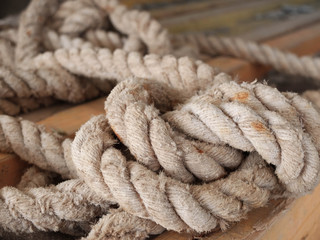 Rolled knotted rope with stain spots