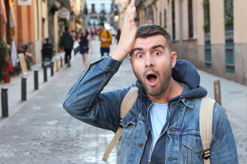Forgetful man walking in the city.