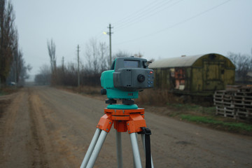 Digital level on the tripod. Leveling, geodetic works