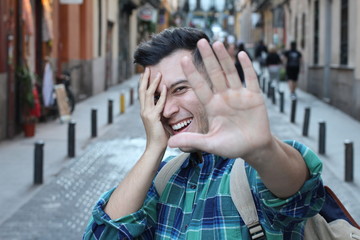Man feeling shyness when the camera is on him