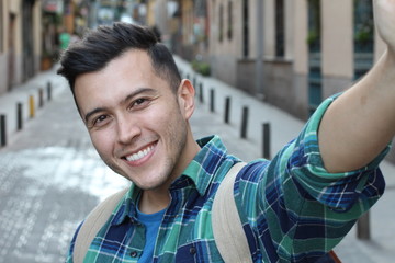 Very handsome ethnic man taking a selfie 