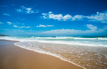 Yellow sand beach, sea and deep blue sky.