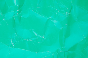 Abstract colored crumpled paper texture, decorative background.