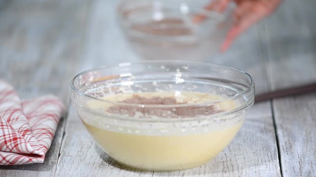 Mixing Cocoa Powder, Flour and Beaten Eggs. Making Chocolate Layer Cake. Series.