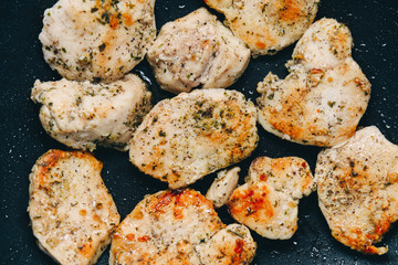 Fried chicken breast. Chicken breast in a pan. Chicken with spices.