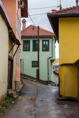 Narrow street in the historic district of Sarajevo in autumn. Bosnia and Herzegovina