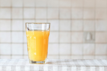 Glass of orange juice in the kitchen.