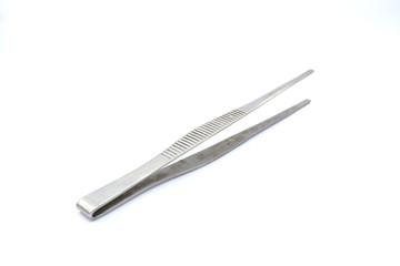 Closeup of dirty medical pincette isolated on white background.