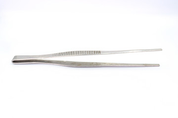 Closeup of dirty medical pincette isolated on white background.