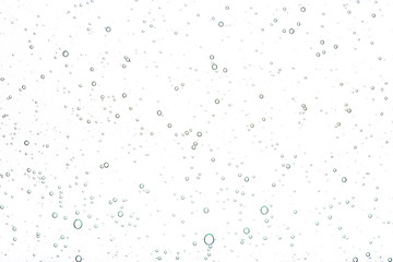 Transparent gel with bubbles close-up. The texture of gel cream. Oxygen bubbles in clear blue water, close-up. Mineral water. Water enriched with oxygen.