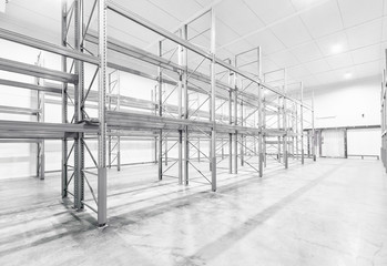 monochrome Interior of empty warehouse with empty racks