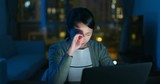 Woman work on computer and feel tired at home