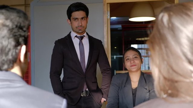 Junior company employees are treated with disdain and instructed by the assistant sidekick to their boss to leave and resign 